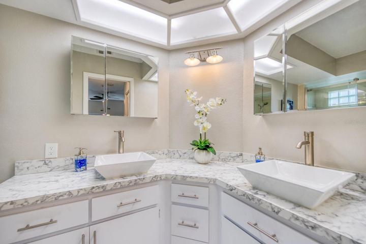 En suite with updated dual sink vanity & cabinets~