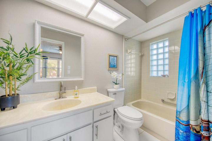 En suite with tub/shower & oversize linen closet~
