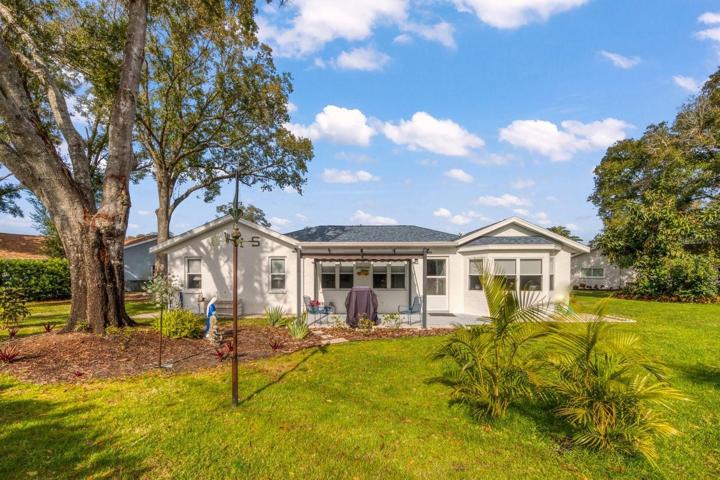 Home has attractive rear elevation complemented by oversize yard~