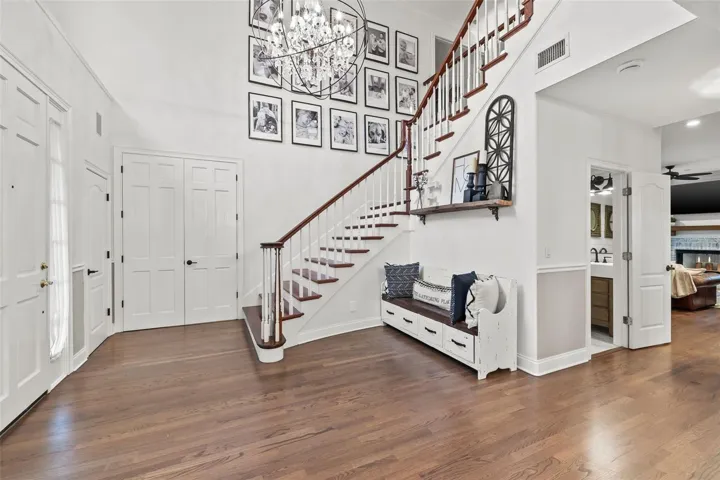 grand foyer entrance, adorned with a stunning chandelier