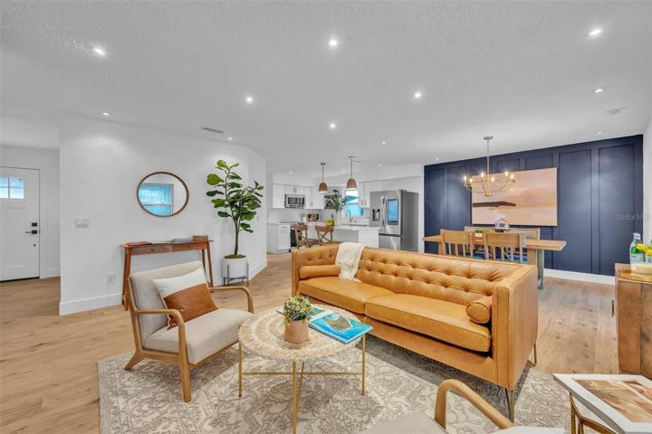 Right off the office is a beautiful living room with the custom lighting throughout.