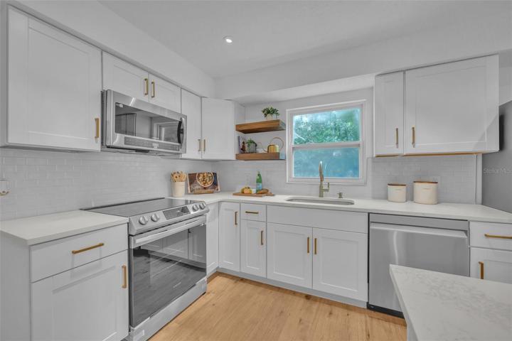 This home has timeless upgrades, from the all white custom subway tile to the carera quartz countertops. Keeping this home clean will be a breeze.