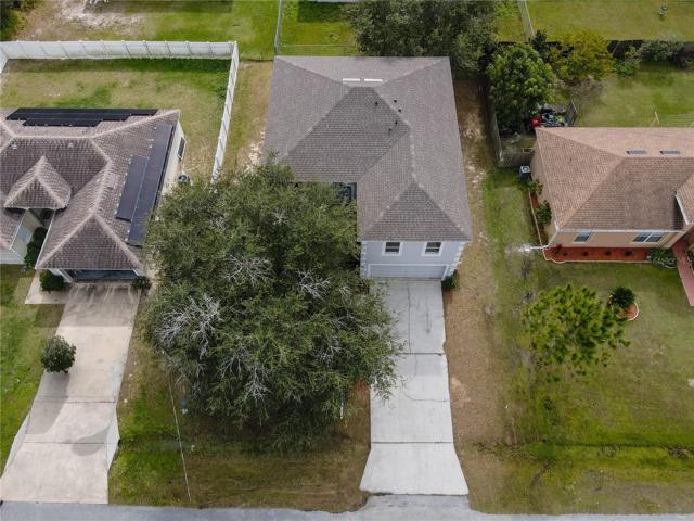 Spacious lot with huge tree in front