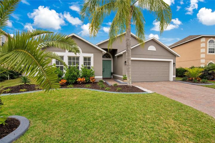 Exterior front; freshly painted with newer landscaping and paver drive