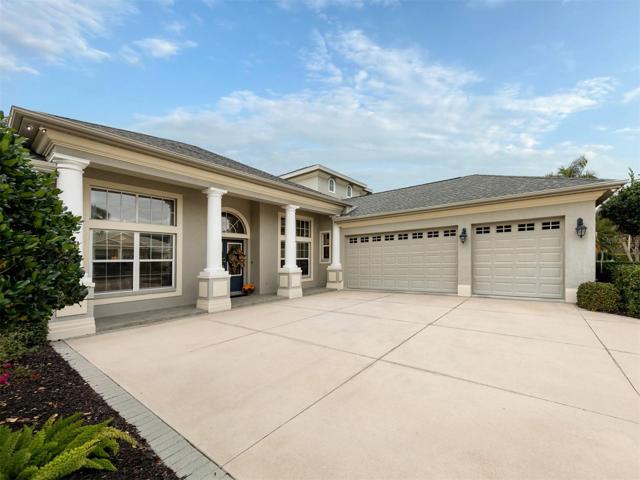 Large driveway leading to entrance and 3 plus garage