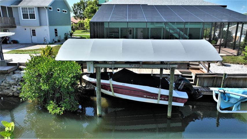 Dock, lift, cabana and boat