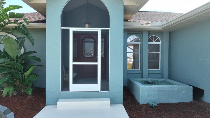Enter the front porch and enjoy the sound of the fountain.
