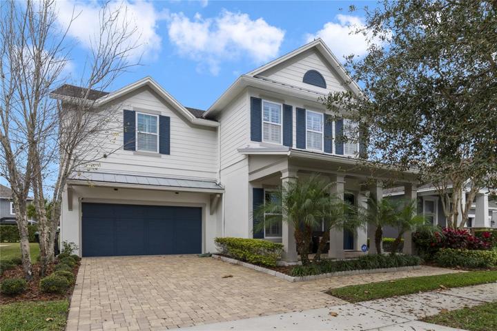 Perfectly situated in the highly sought-after Latham Park community of Winter Garden this spacious home delivers a bright open concept with a TWO-STORY LIVING ROOM and MAIN FLOOR PRIMARY SUITE!