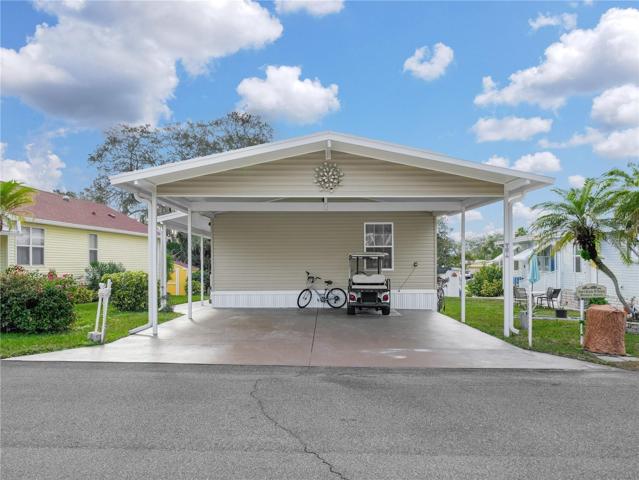 The carport is large enough for two cars - and your golf cart!