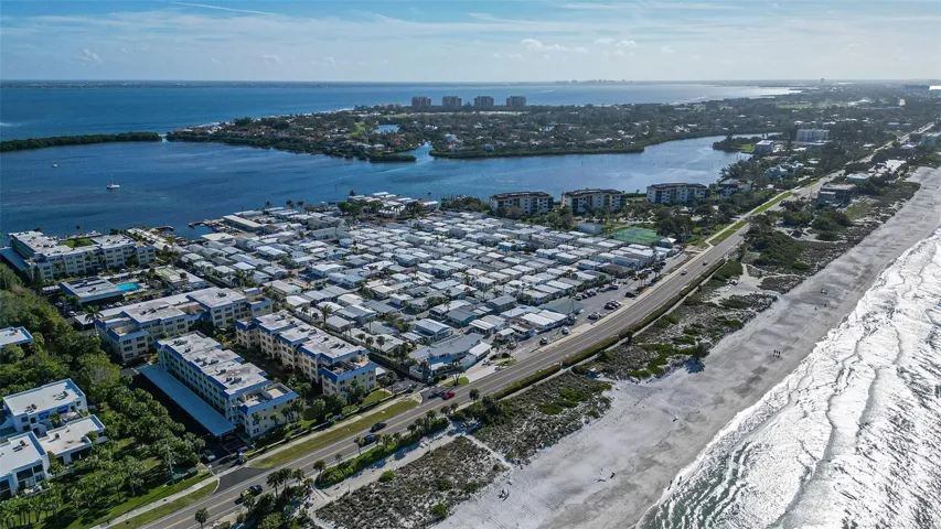 aerial facing the bay with a glimpse of the beach to the right