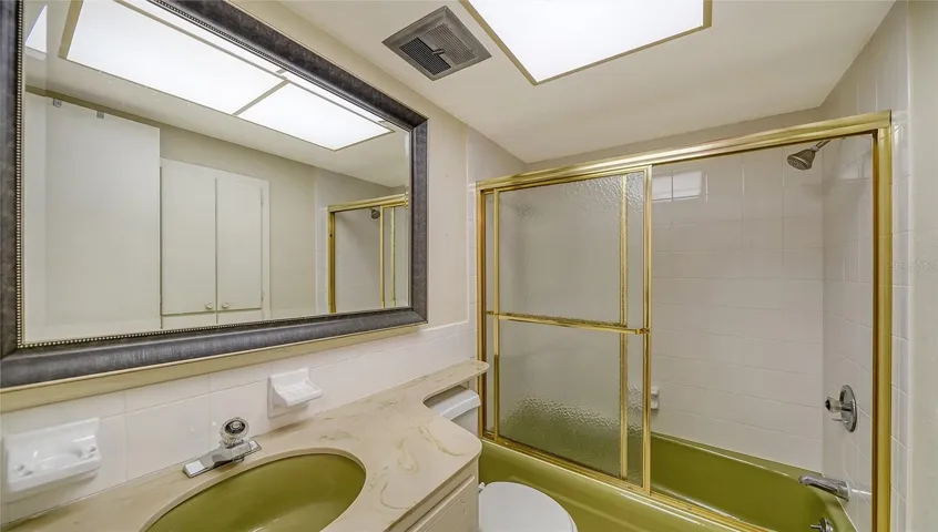 hallway bathroom that's used by 2nd bedroom