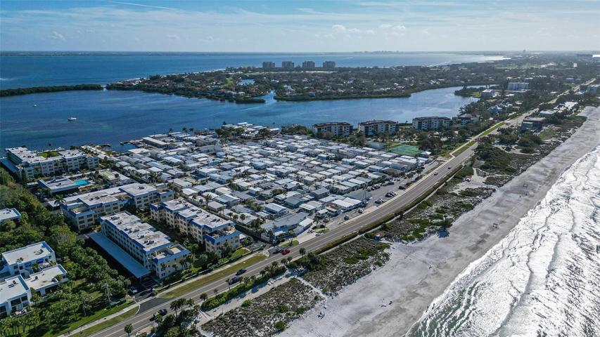 aerial facing the bay with a glimpse of the beach to the right
