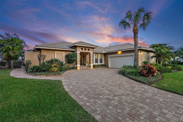 Elegant side entry garage with paver driveway
