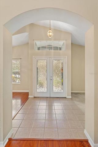 Double front doors with tiled inside foyer
