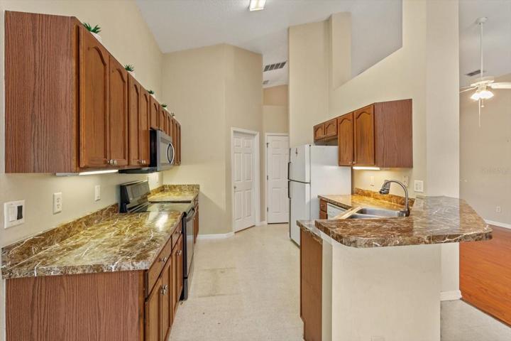 Looking into the Kitchen with Laundry room at the end and pantry