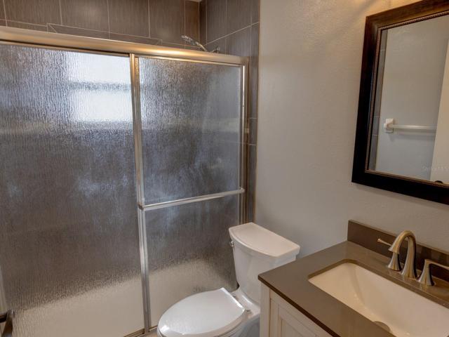 Hall bathroom with shower and updated vanity.