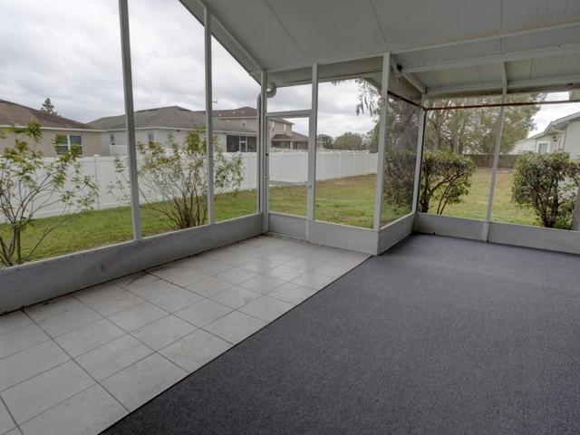 Enclosed lanai and view of the back yard.