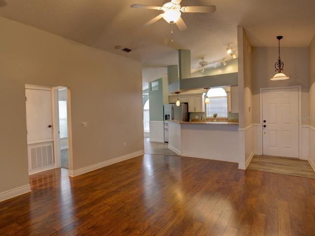 Front entrance.  View of kitchen and dining room.