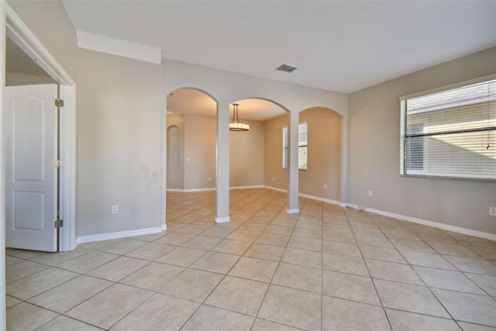 Welcome Home!  Doors to the left is the den/office and the family room in front with the archways to the dining area.