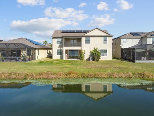 Aerial view from the pond to the rear of the home.
