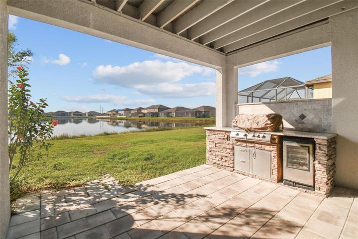 Paved patio and a built-in grill.  Great place for family gatherings and cookouts.