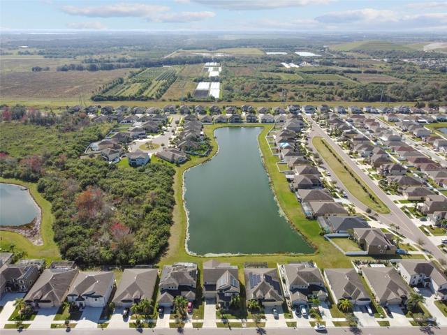 Aerial view of the home and pond.