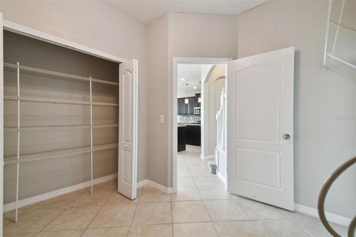 Laundry room with view out to the kitchen.