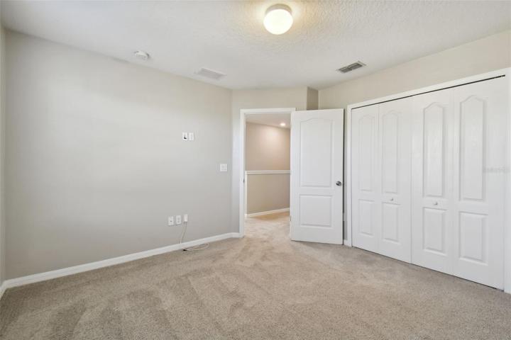 Bedroom 3 which is adjacent to the second bathroom.