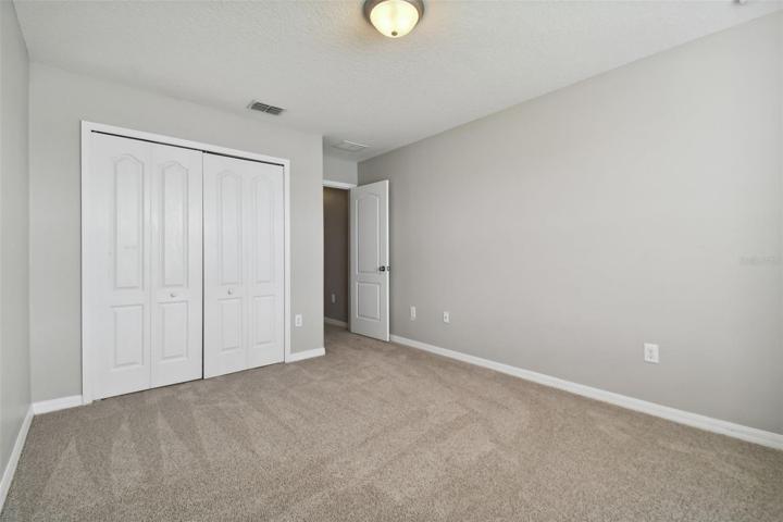 Bedroom 5 which is adjacent to the third bathroom.