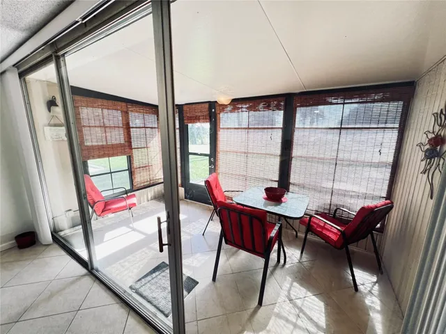 Generous sized Florida room with room darkening blinds