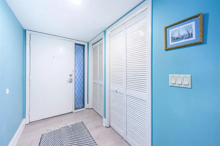 .. Foyer / Front Door ..  Laundry Room To Right in Photo -  A/C Room on Right in Photo..