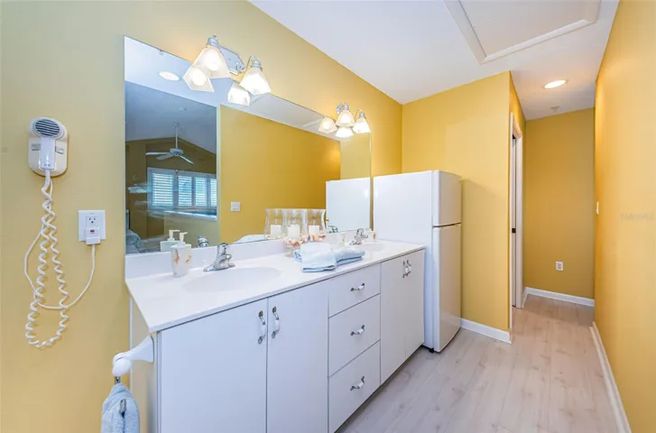 .. 2nd Level - Bathroom Shot Looking Right with Refrigerator next to Privacy Room.