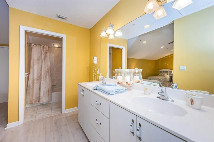 2nd Level Bathroom -- Bathroom runs 20 Feet along Wall with Tub & Shower on Left Side with Door - Double Vanity in Middle and Privacy Room on Right Side.. Unit can be Easily Plumbed For another Toilet next to Tub..