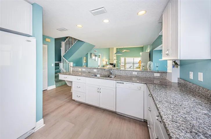 .. Kit #5.. Home has Good Aesthetics with Open Space, 18 Foot Ceilings in Great Room , Stairway to 2nd Floor and an Abundance of Natural Light . View From Kitchen Area
