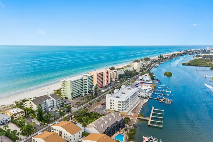 .. PHOTO TAKEN AT 12 NOON LOOKING NORTH UP THE GULF... BEACH HOUSE ON LEFT NEXT TO GREEN COMPLEX.