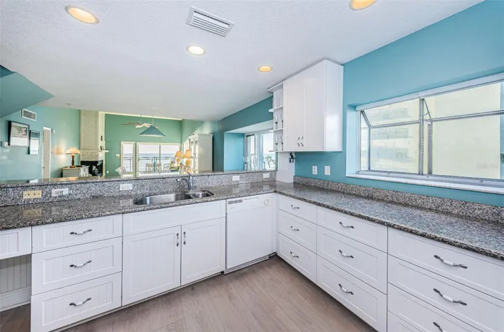 ...Main Floor: Kit #6.. Both Kitchen & Dining Area have Bay Windows on North Side Allowing Open Views and Wonderful Natural Light Flowing into the Home..