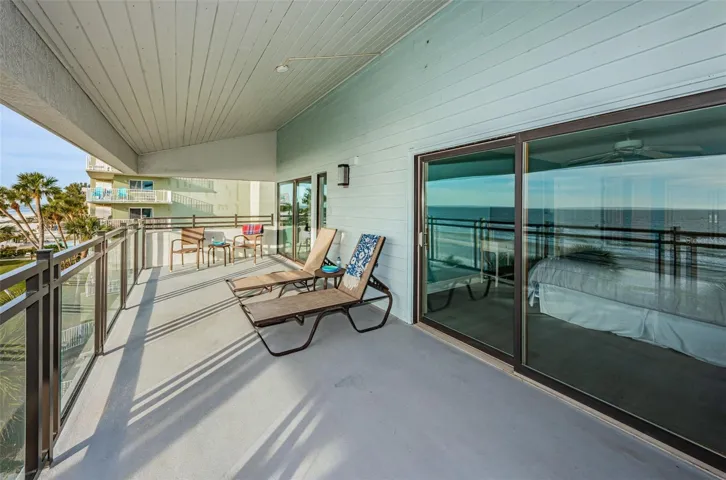 ... Top Floor has Balcony Covered with Roof Line.. Plenty of Room Here with a 27' x 10' Area to Relax..