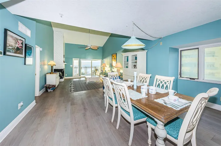 .... This Penthouse - Corner Unit - Great Room Area Consisting of the Living Room &  Dining Room has about a 33' Long and  16' Wide run to it.. Master Bedroom Door to Left By Lamp. Plenty of Natural Light.