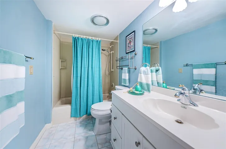 .. Main Floor : Guest Bathroom 5.3 x 9.3 ... Tub  With Shower.. Guest Bathroom Services Both Rear Guest Bedrooms.