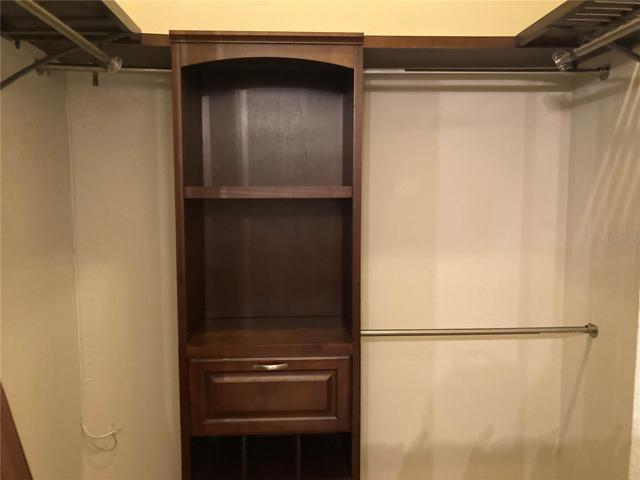 large walk in close with built in storage