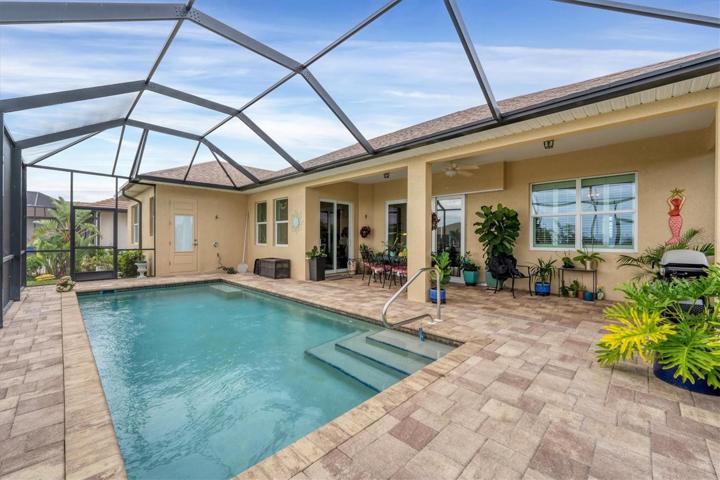 Rear of home with pavers through out the Lanai.