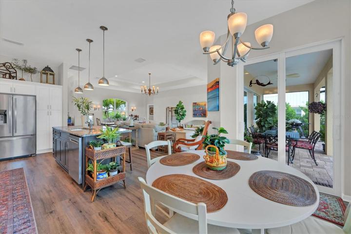 Breakfast area in the forefront , L/R & Dining area in the background. Open & airy floor plan.