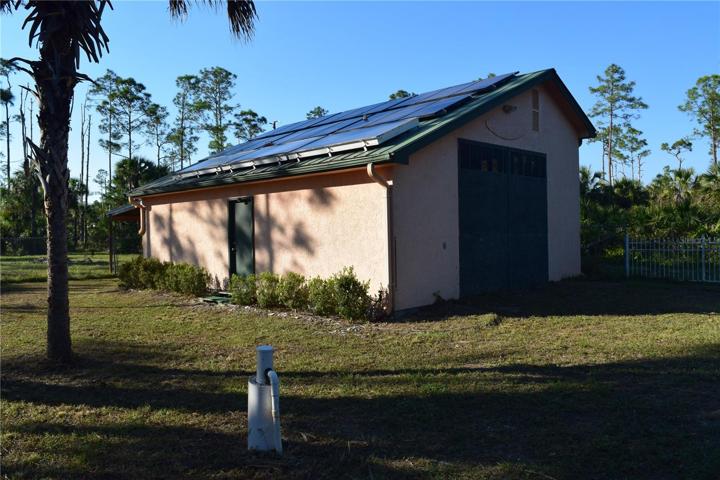 building with loft and solar power panels