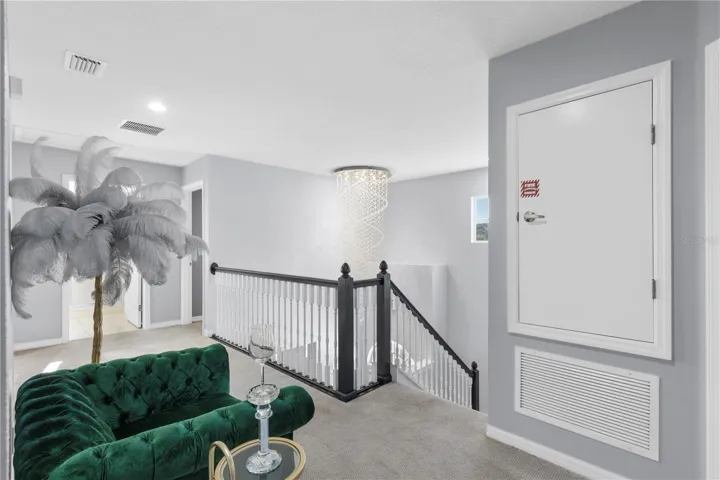 Upstairs loft with a view of your luxury chandelier at the foyer entry way