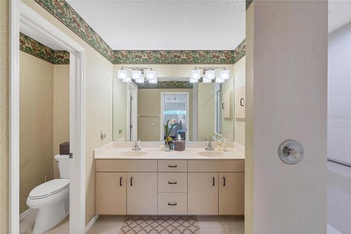 The master bath has dual sinks, a roman shower and plenty of storage.