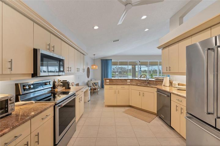 Huge kitchen with built in desk, granite counter tops and plenty of cabinets