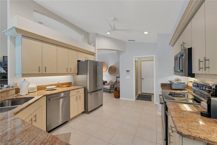 Walk from the kitchen into the laundry room which also exits to the garage