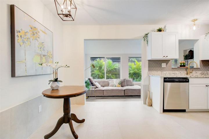 Your view from the couch, hallway leads to bedrooms and bathroom, dining and kitchen are on the right.