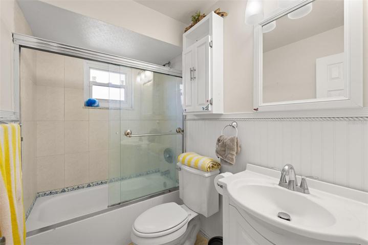 Second bathroom with tub and shower