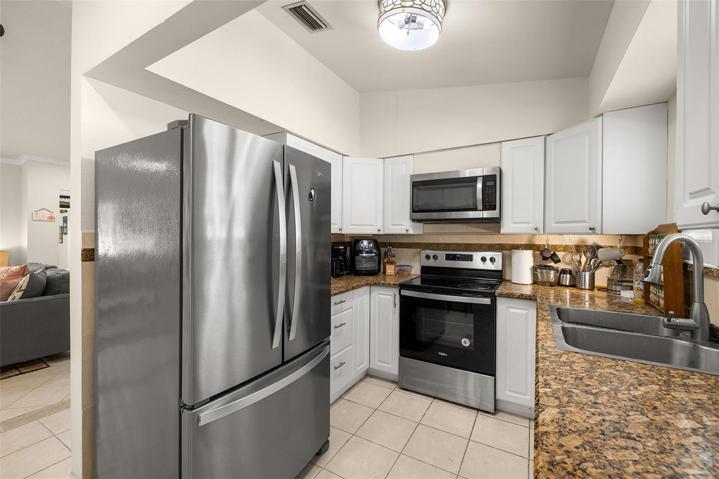 Kitchen with granite and stainless steel appliances